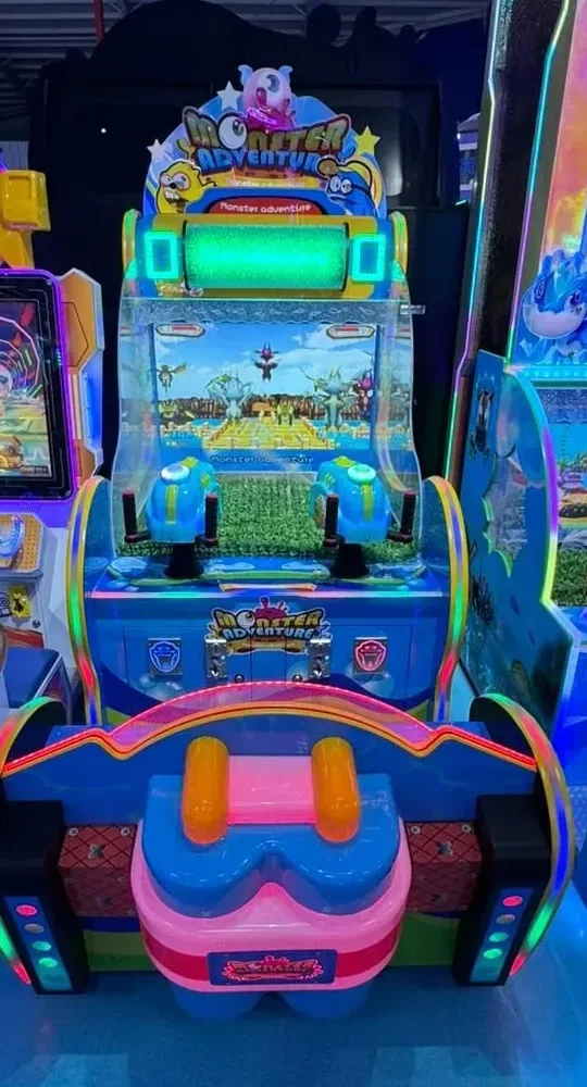 Monster Adventure kids' screen-based ride and shooter machine, colourful cabinet