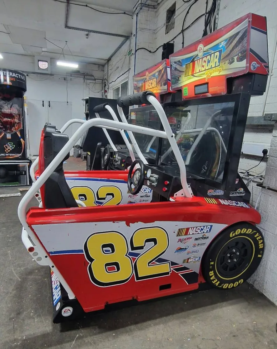 Two NASCAR Racing sit-in racing cabinets side by side, number 82