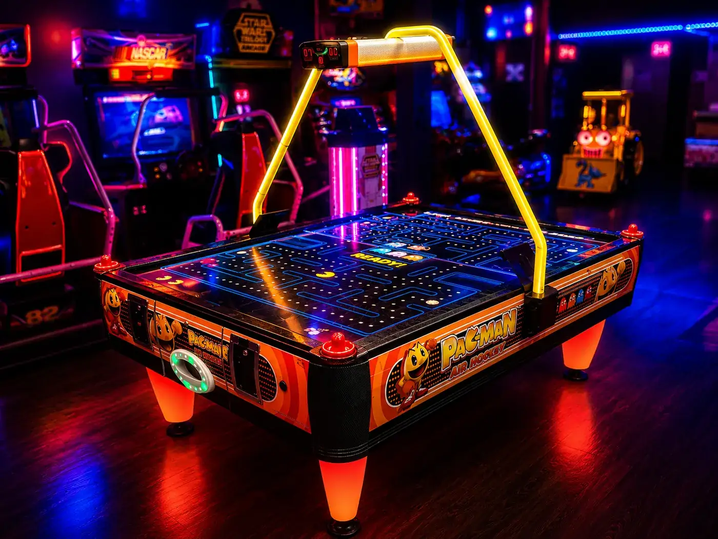 Pac-Man Air Hockey table with glowing maze playfield and overhead goal frame
