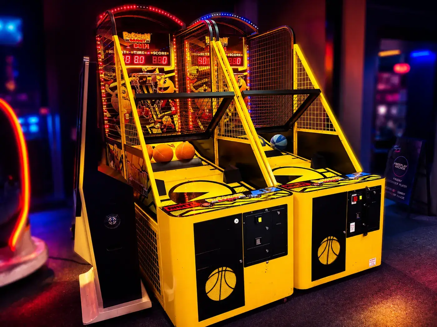 Twin-lane Pac-Man Basket machine with yellow cabinets and Pac-Man backboards