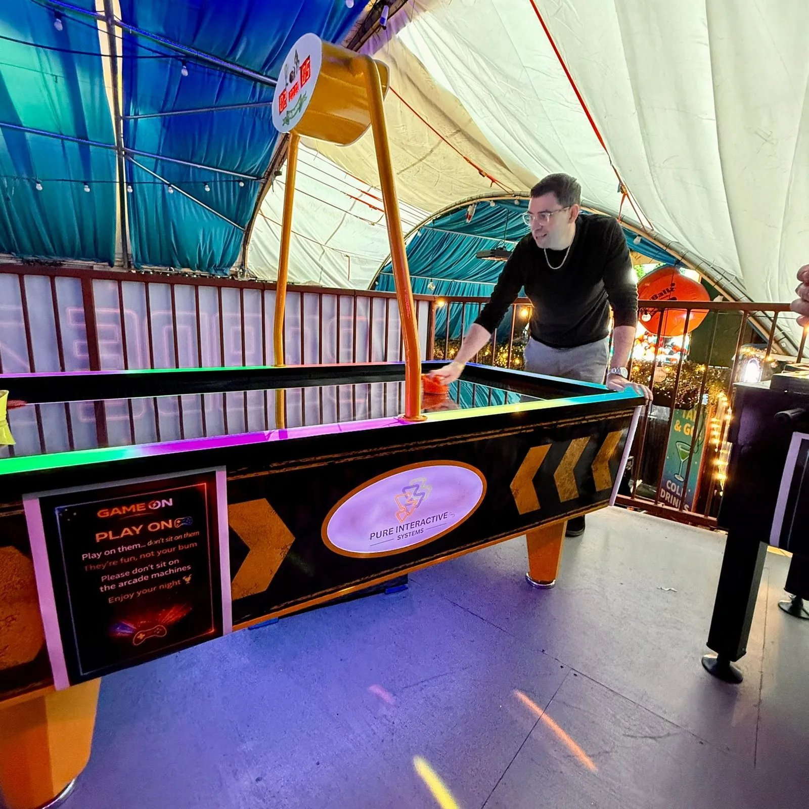 Power Glide air hockey table in play at Fire, Vauxhall