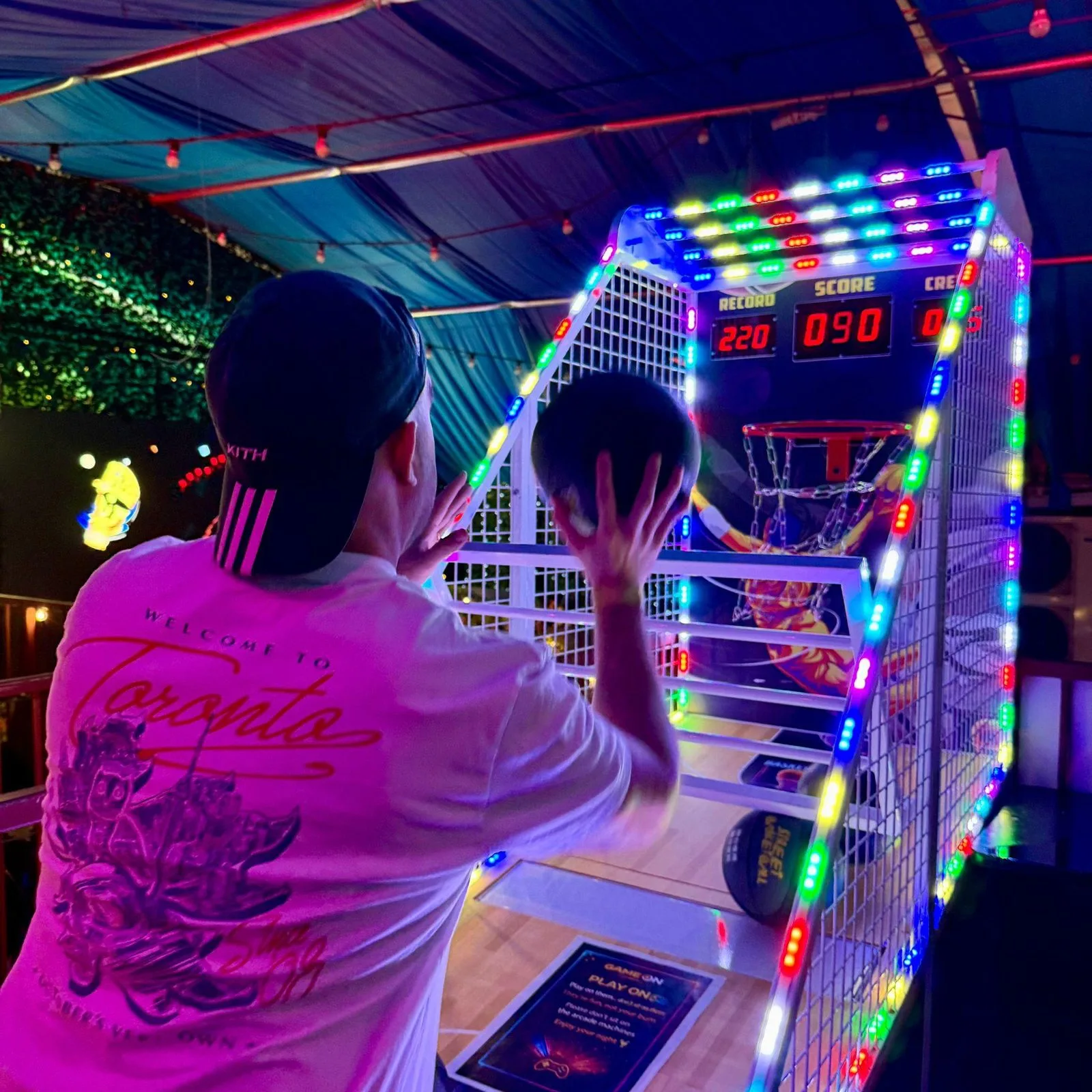 Power Hoops basketball machine with scoreboard lit during play at Fire London, Vauxhall